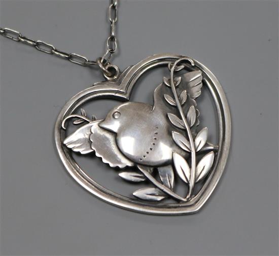 A Georg Jensen sterling silver heart shaped robin pendant, no. 97, on chain, pendant 40mm.